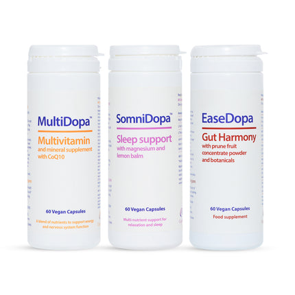Three supplement containers labeled 'Multidopa', 'SomniDopa', and 'EaseDopa' on a white background.