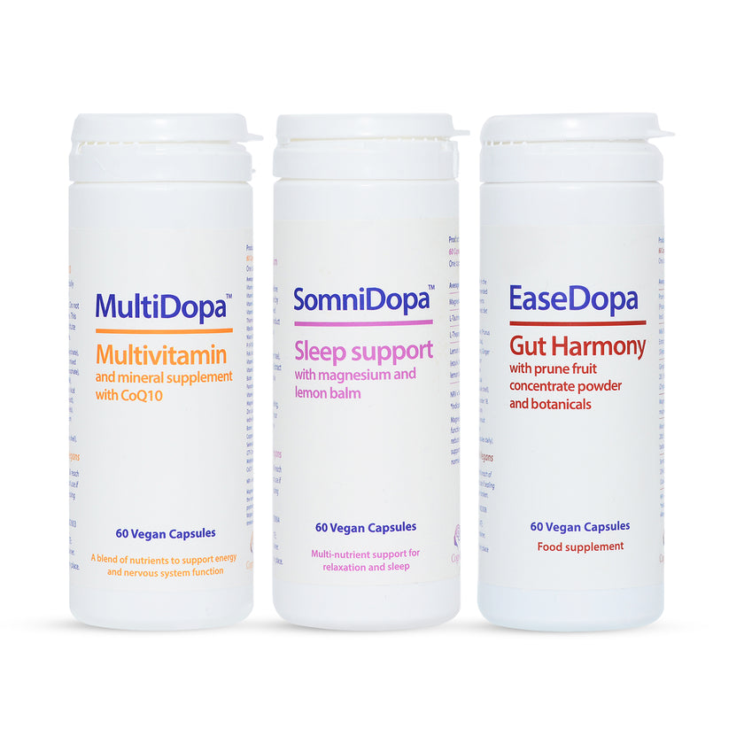 Three supplement containers labeled 'Multidopa', 'SomniDopa', and 'EaseDopa' on a white background.